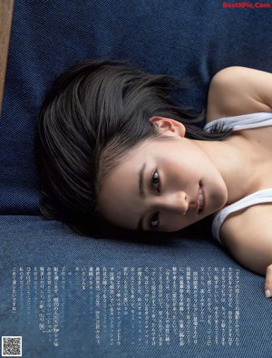 a magazine with a woman sitting on a couch