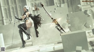 A naked woman standing in front of a giant robot.