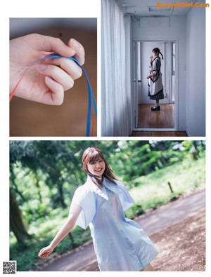 A woman standing in a bedroom holding a blue ribbon.