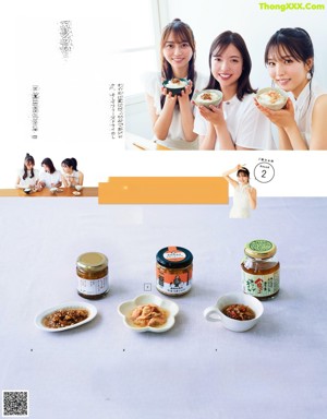 A group of young women eating food with chopsticks.