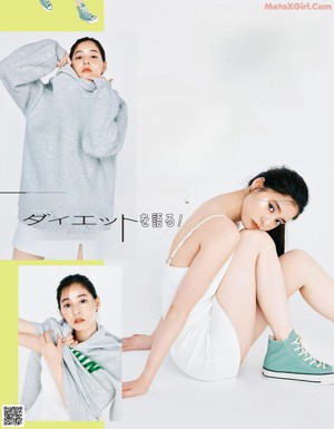 A woman in a gray hoodie is posing for a magazine.