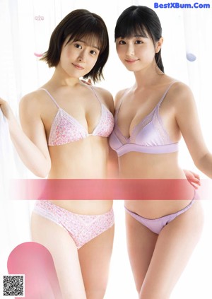 A couple of women standing next to each other in underwear.